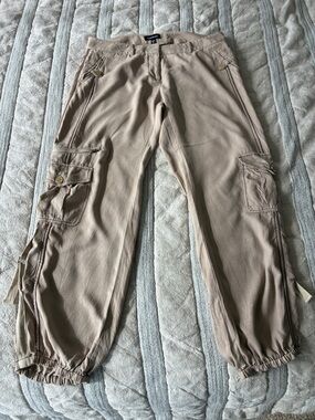 bebe Women's Tan Cargo Pants with loosely elasticized cuffs